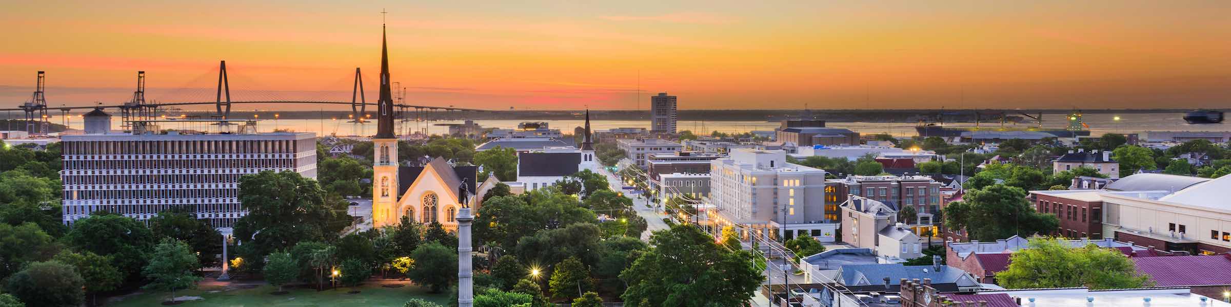 Sunset view of Charleston, SC, looking out over Marion Square toward the river.